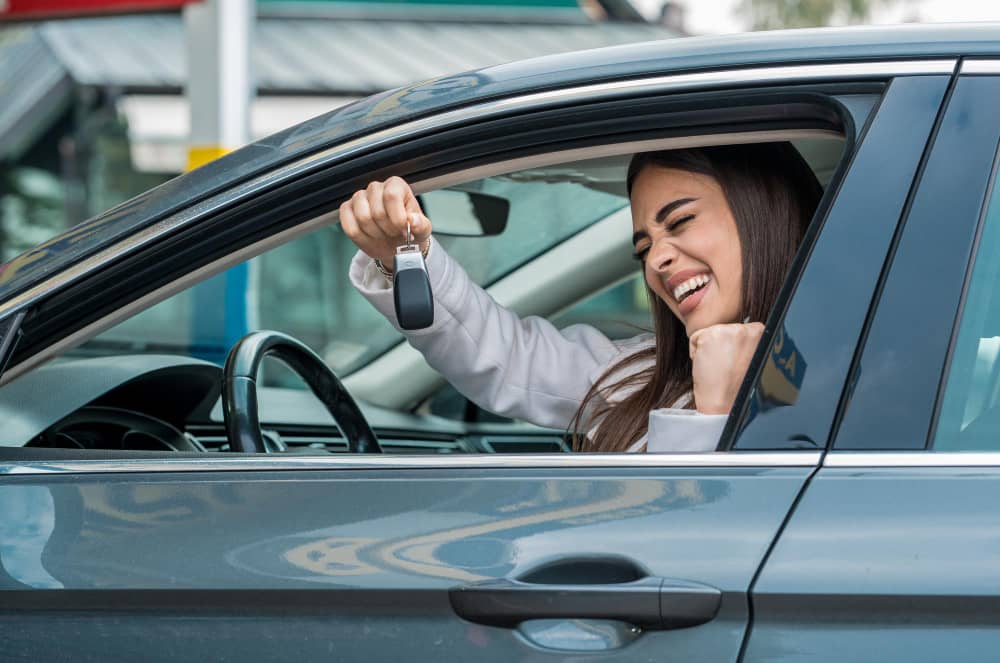 attractive female posing wheel her car 1 VW